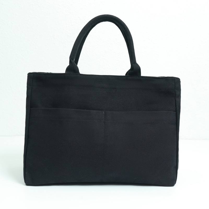 Black canvas bag with bottom and side panel
