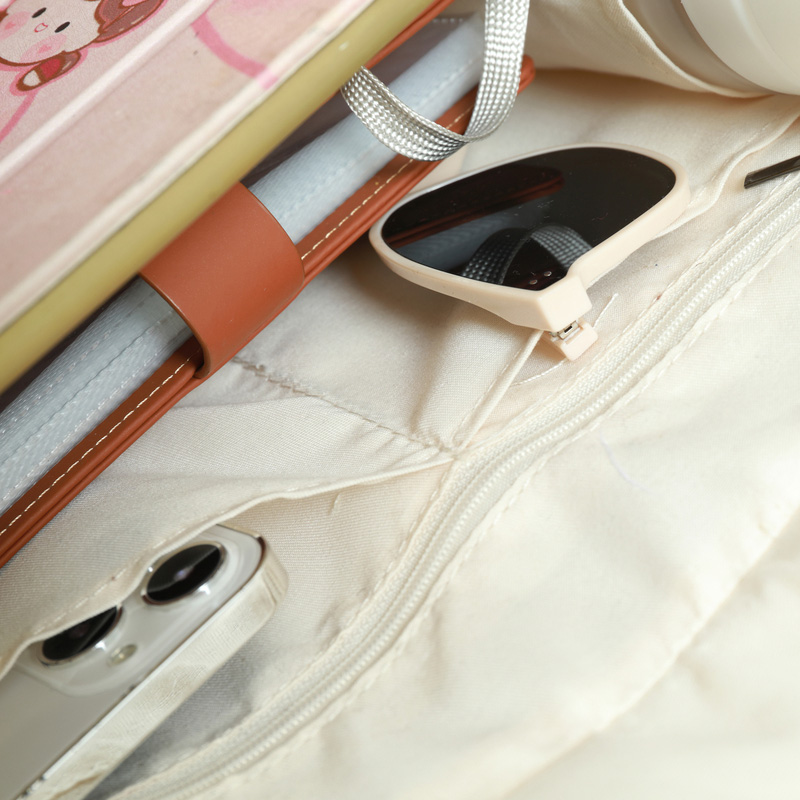 White canvas bag with bottom and side straps and 2 pockets