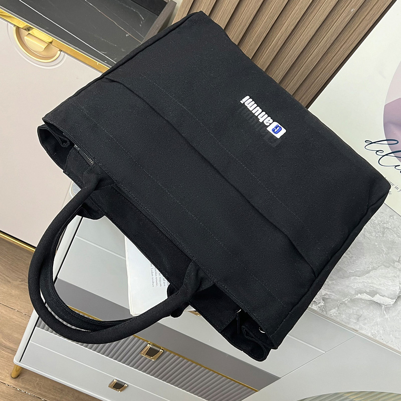 Black canvas bag with bottom and side panel