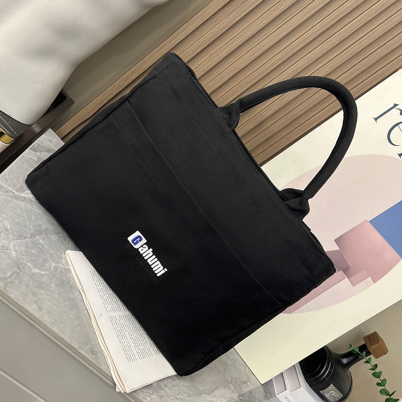 Black canvas bag with bottom and side panel